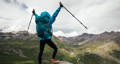 Man celebrating reaching summit 
